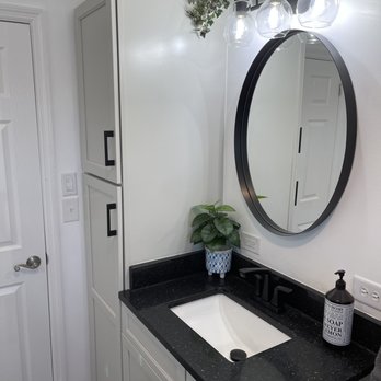 Atlas Kitchen And Bath - a sink and mirror - Flooring Near Me - Johnson City, Tennessee Atlas Kitchen And Bath - a sink and mirror - Flooring Near Me - Johnson City, Tennessee