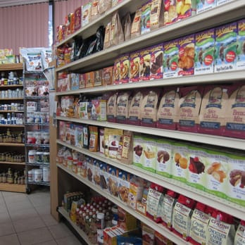 A New Leaf - a grocery store aisle filled with products - Juice Bars & Smoothies Near Me - Needham, Massachusetts