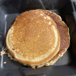 a stack of pancakes in a pan a stack of pancakes in a pan
