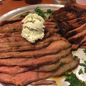Stonefire Grill - Whole Tri Trip (Family Meal) - (left) pepper garlic w/ Gorgonzola butter, (right) mesquite BBQ - Barbeque Near Me - Chatsworth, California