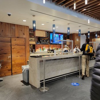 The Centurion Lounge - Bar area. Posting pic that has least amount of people in it for their privacy. - Airport Lounges Near Me - Dallas, Texas