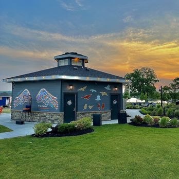 The Birdcage - a colorful sunset in the background - Cocktail Bars Near Me - Canandaigua, New York