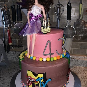 Cakes On Main - a barbie doll on top of a cake - Custom Cakes Near Me Cakes On Main - a barbie doll on top of a cake - Custom Cakes Near Me