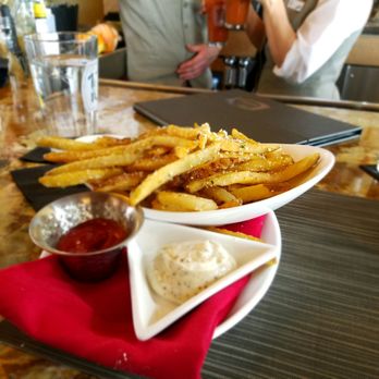 The 10th - Truffles fries crispy on outside and warm throughout mixed well and diffusely with parmesean - New American Near Me - Vail, Colorado The 10th - Truffles fries crispy on outside and warm throughout mixed well and diffusely with parmesean - New American Near Me - Vail, Colorado