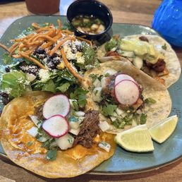 Three tacos with a side salad...