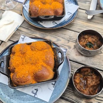 Ettan - Cast Iron "Monkey Buns"- homemade butter and eggplant chutney on the side - Indian Near Me - Palo Alto, California