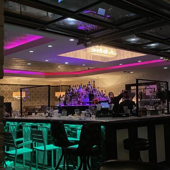 Bardot - Neon changing and fading in the bar area. - New American Near Me - Claremont, California