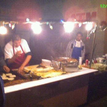 Tacos Oscarin - a group of people preparing food - Mexican Near Me - Los Angeles, California Tacos Oscarin - a group of people preparing food - Mexican Near Me - Los Angeles, California