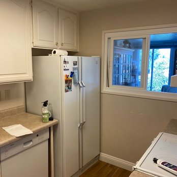 Asha Construction - Old kitchen with frig jammed in corner - General Contractors Near Me