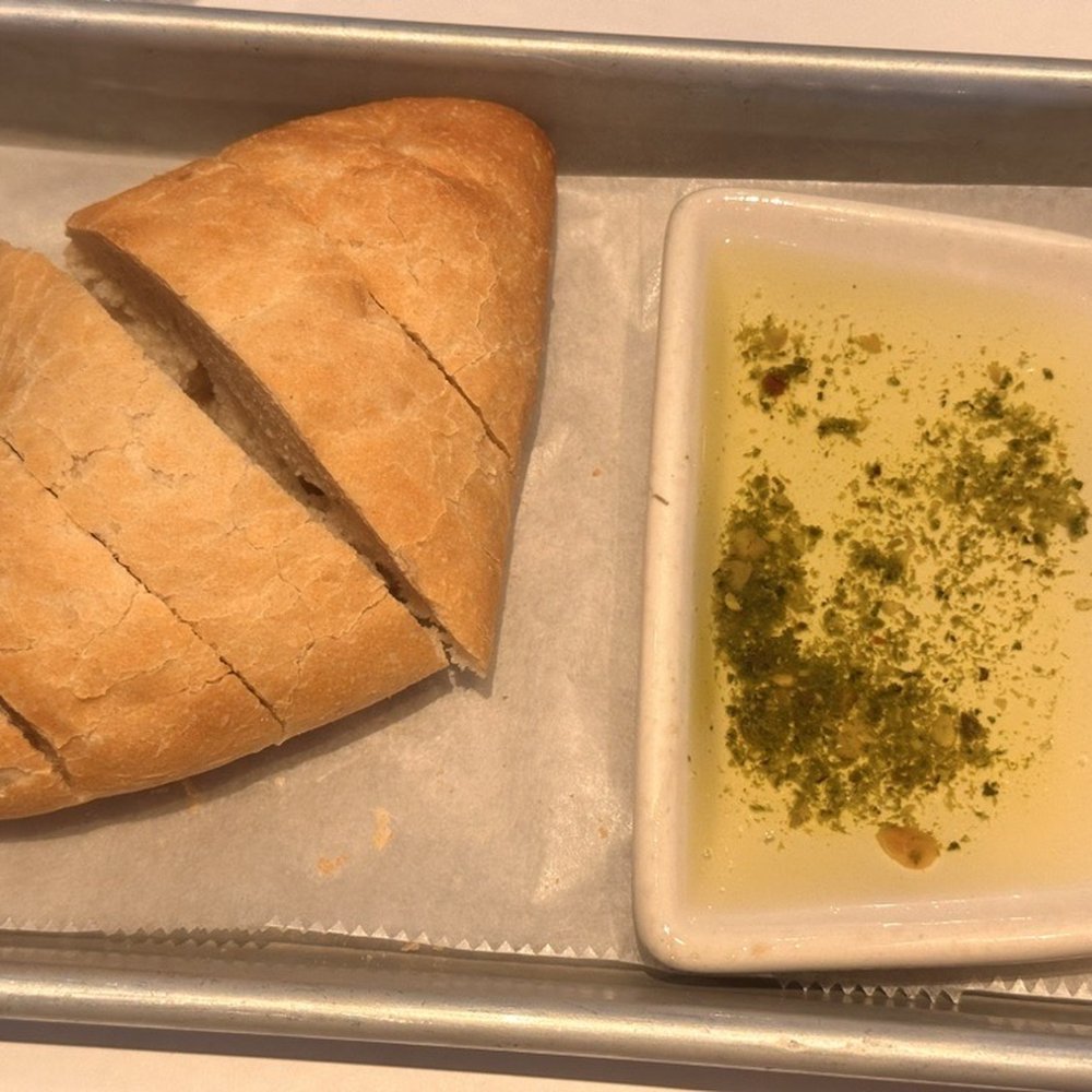 Complimentary Bread w/ herb-infused oil.  Tasty!