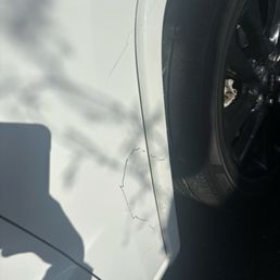 Tar that is still there. I literally scratched it a little and it started coming off.