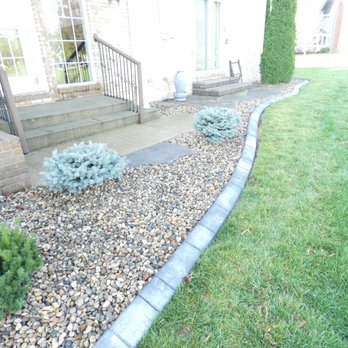 Elite Curb - a view of a front yard with landscaping - Landscaping Near Me
