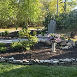 Larlham Landscape Construction - Finished landscaping with plantings, repaired stone walls, stone path and mulch