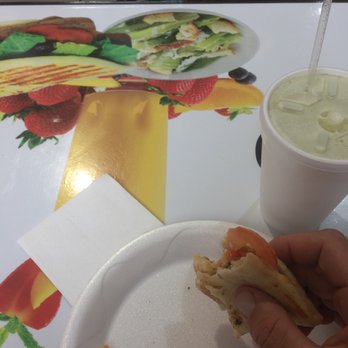 Rio Station Juice Bar - a person eating a sandwich - Cuban Near Me - Cutler Bay, Florida Rio Station Juice Bar - a person eating a sandwich - Cuban Near Me - Cutler Bay, Florida