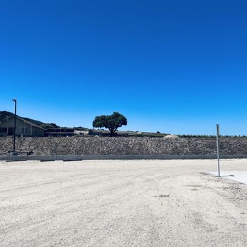 Rustique Wines - an empty parking lot with a stop sign in the foreground - Wine Tasting Room Near Me - Salinas, California Rustique Wines - an empty parking lot with a stop sign in the foreground - Wine Tasting Room Near Me - Salinas, California
