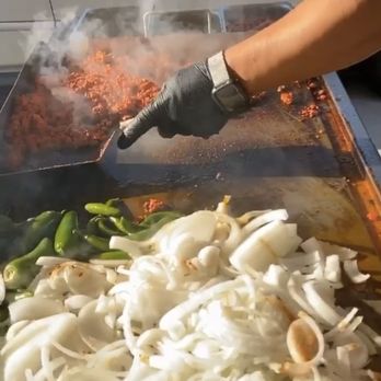 Rodriguez Tacos - Prepping Some grilled onions - Caterers Near Me Rodriguez Tacos - Prepping Some grilled onions - Caterers Near Me