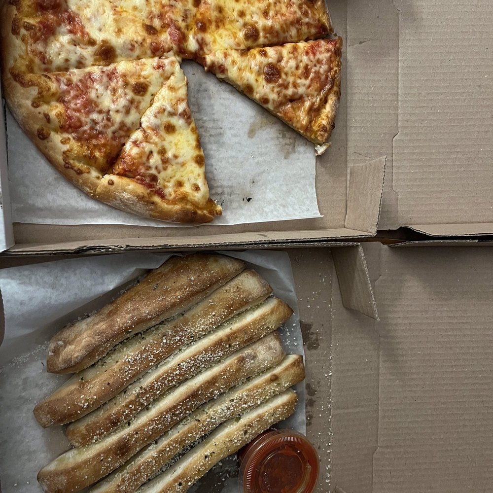 Medium cheese pizza and breadsticks Medium cheese pizza and breadsticks