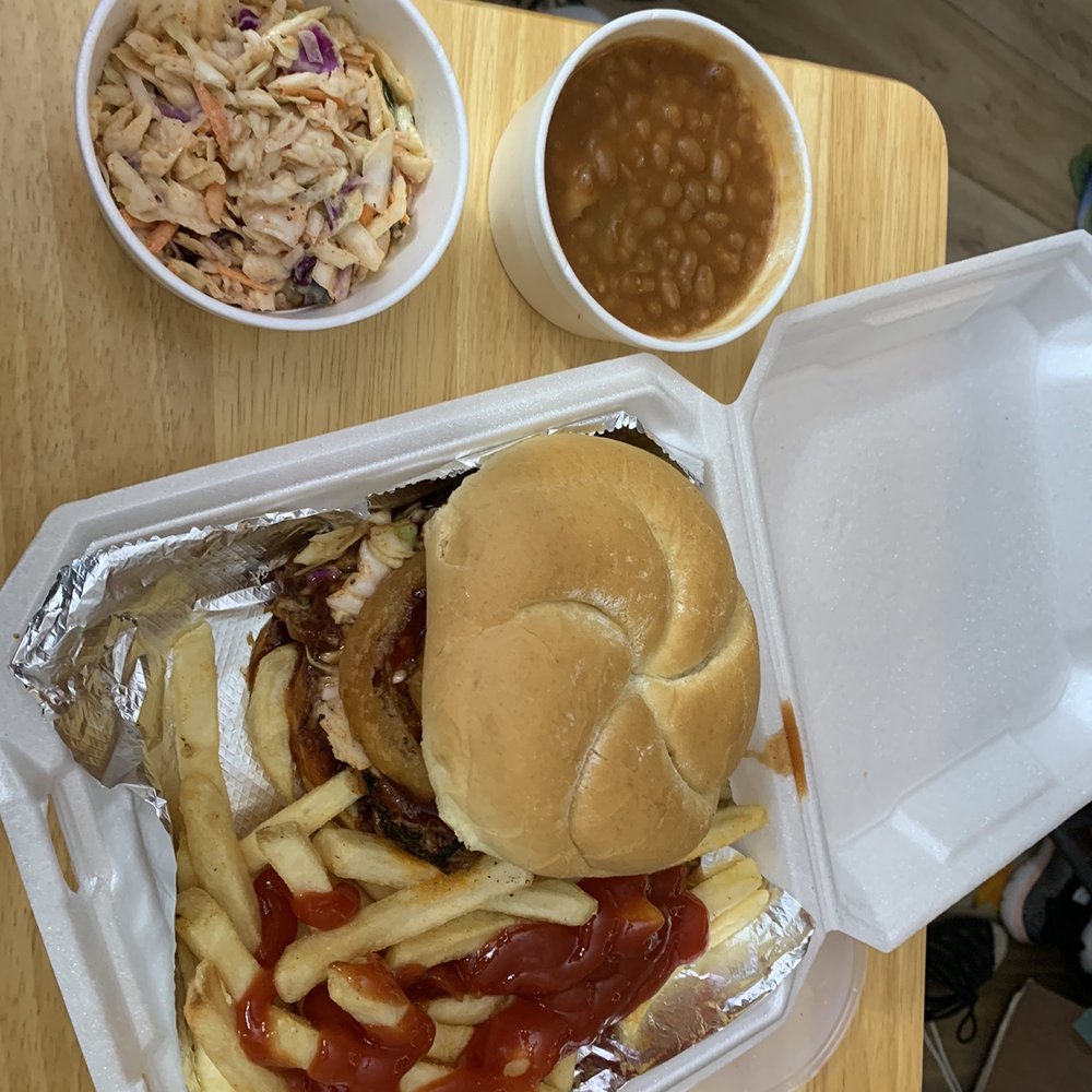 1/2 pound,pulled bbq pork, cole slaw and ff onion on large bun. Sides baked beans and spicy cole slaw.