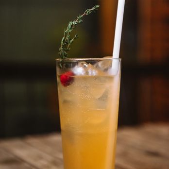 Urban Hearth - a glass of lemonade with a sprig of rosemary - New American Near Me - Cambridge, Massachusetts