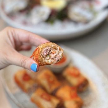 Chispa Food | Drink - Lumpia w/ pork, sweet chili sauce | $15 (3 pc cut into halves) - Cocktail Bars Near Me - Napa, California Chispa Food | Drink - Lumpia w/ pork, sweet chili sauce | $15 (3 pc cut into halves) - Cocktail Bars Near Me - Napa, California