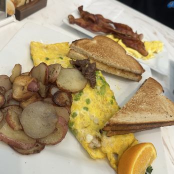 Keke's Breakfast Cafe - Cheese Steak Omelet with toast & Homefries. - Breakfast & Brunch Near Me - Clarksville, Tennessee Keke's Breakfast Cafe - Cheese Steak Omelet with toast & Homefries. - Breakfast & Brunch Near Me - Clarksville, Tennessee