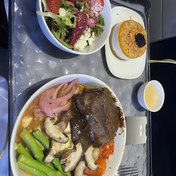 Delta Air Lines - Short rib dinner with spinach strawberry salad and dessert - Airlines Near Me - Chicago, Illinois Delta Air Lines - Short rib dinner with spinach strawberry salad and dessert - Airlines Near Me - Chicago, Illinois