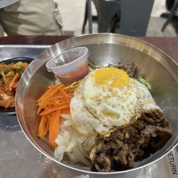 Korean Restaurant - Bibimbap with fried egg. Kimchi on the side.