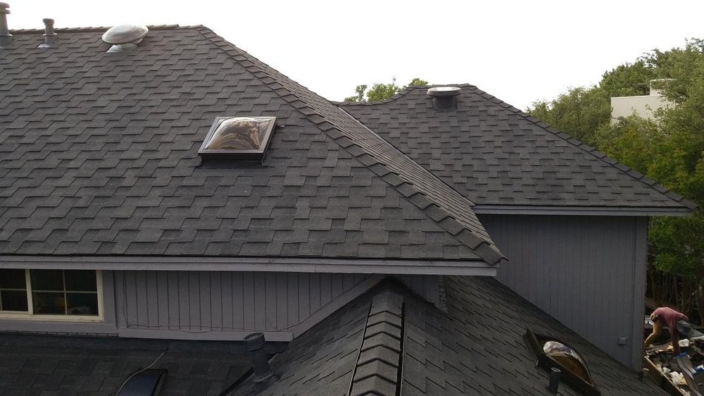 Slide of Cowtown Roofing