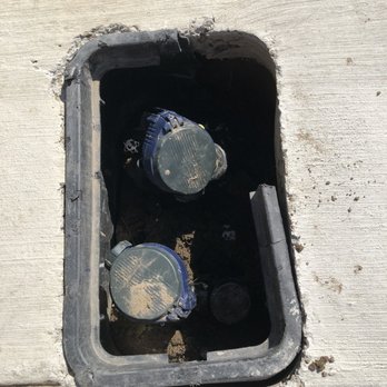 Oc Landscape Solutions - sprinkler job - broke the plastic and messed up concrete - Landscaping Near Me
