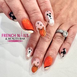 French Nails - Pumpkin spice and everything nice! Embrace the season with our charming pumpkin nails--perfect for your Halloween festivities!