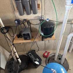 Jerry's Pump Service - Before : sump pump lid on the left poorly fitting. Ejector pit on the right not properly seated.