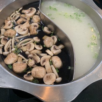 Coco Hot Pot - Mushroom and chicken broth heating. - Chinese Near Me - Columbus, Ohio