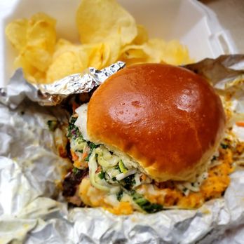 La Verdad Cafe Deli - Burnt Ends Stretchmark sandwich in a foil wrapper, containing BBQ meat, kaleslaw, and mac n cheese on a bun with potato chips. - Smokehouse Near Me - Buffalo, New York La Verdad Cafe Deli - Burnt Ends Stretchmark sandwich in a foil wrapper, containing BBQ meat, kaleslaw, and mac n cheese on a bun with potato chips. - Smokehouse Near Me - Buffalo, New York