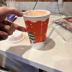 Half filled latte cup