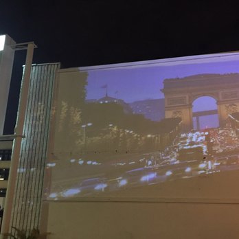 Cafe Giverny - Slides projector on the wall at the front parking lot - Desserts Near Me - Los Angeles, California Cafe Giverny - Slides projector on the wall at the front parking lot - Desserts Near Me - Los Angeles, California