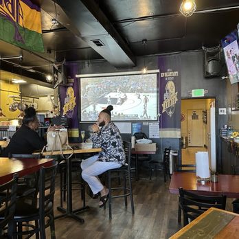 Nola Voodoo Tavern - Sitting area that has a nice big tv screen - Cafes Near Me - Denver, Colorado