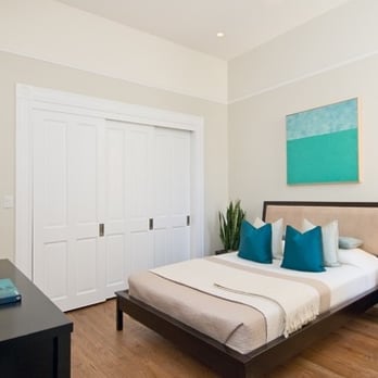 Green Street Construction - a bedroom with a bed and nightstand - General Contractors Near Me - Pacifica, California Green Street Construction - a bedroom with a bed and nightstand - General Contractors Near Me - Pacifica, California