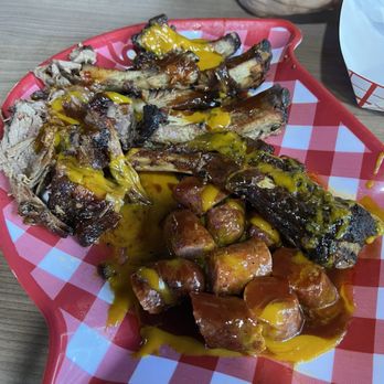 Hip Hop Bbq Shack - Bbq brisket, beef rib, and sausages drizzled with sauce - Barbeque Near Me - San Bruno, California