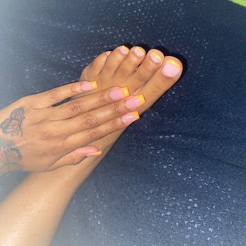 Triangle Nails - Orange Tips --beware tips are an additional $15 on top of the pedicure and full acrylic set - Nail Salons Near Me - Portage, Michigan