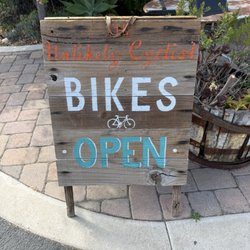 The sign in front of the shop.