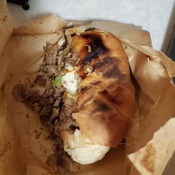 Subway - a half eaten pita sandwich on a piece of paper - Sandwiches Near Me - Missoula, Montana