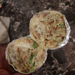 Carnitas super burrito, the sauce that they give with this is very spicy Carnitas super burrito, the sauce that they give with this is very spicy