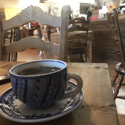 a cup of coffee on a saucer a cup of coffee on a saucer