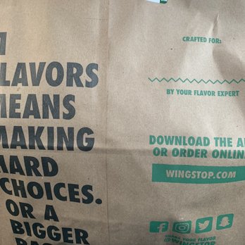 Wingstop - a person holding a bag of food - Chicken Wings Near Me - Huntsville, Alabama Wingstop - a person holding a bag of food - Chicken Wings Near Me - Huntsville, Alabama