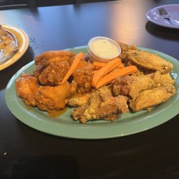 Hot garlic wings on left, garlic parm rubbed wings on the right. Hot garlic wings on left, garlic parm rubbed wings on the right.