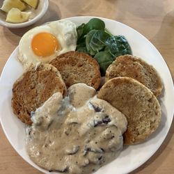 Paige's Place - Homemade biscuits and Mushroom gravy with a sunny side egg & greens.