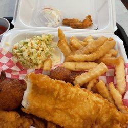 North Atlantic Fish & Chips - Jumbo Shrimp Dinner with a piece of fish, Fries and coleslaw. Yummy hush puppies