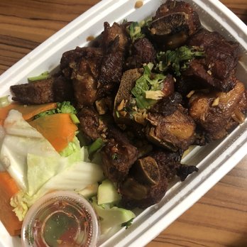 Pho Thai Lao Kitchen - Esan Spare Rib (Fermented Pork Spare Rib) with small sticky rice - Thai Near Me - Maywood, New Jersey Pho Thai Lao Kitchen - Esan Spare Rib (Fermented Pork Spare Rib) with small sticky rice - Thai Near Me - Maywood, New Jersey