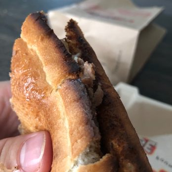 Firehouse Subs - a hand holding a half eaten sub - Sandwiches Near Me - Anaheim, California Firehouse Subs - a hand holding a half eaten sub - Sandwiches Near Me - Anaheim, California