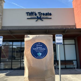 Tiff's Treats - a hand holding a bag of coffee - Desserts Near Me - Austin, Texas Tiff's Treats - a hand holding a bag of coffee - Desserts Near Me - Austin, Texas